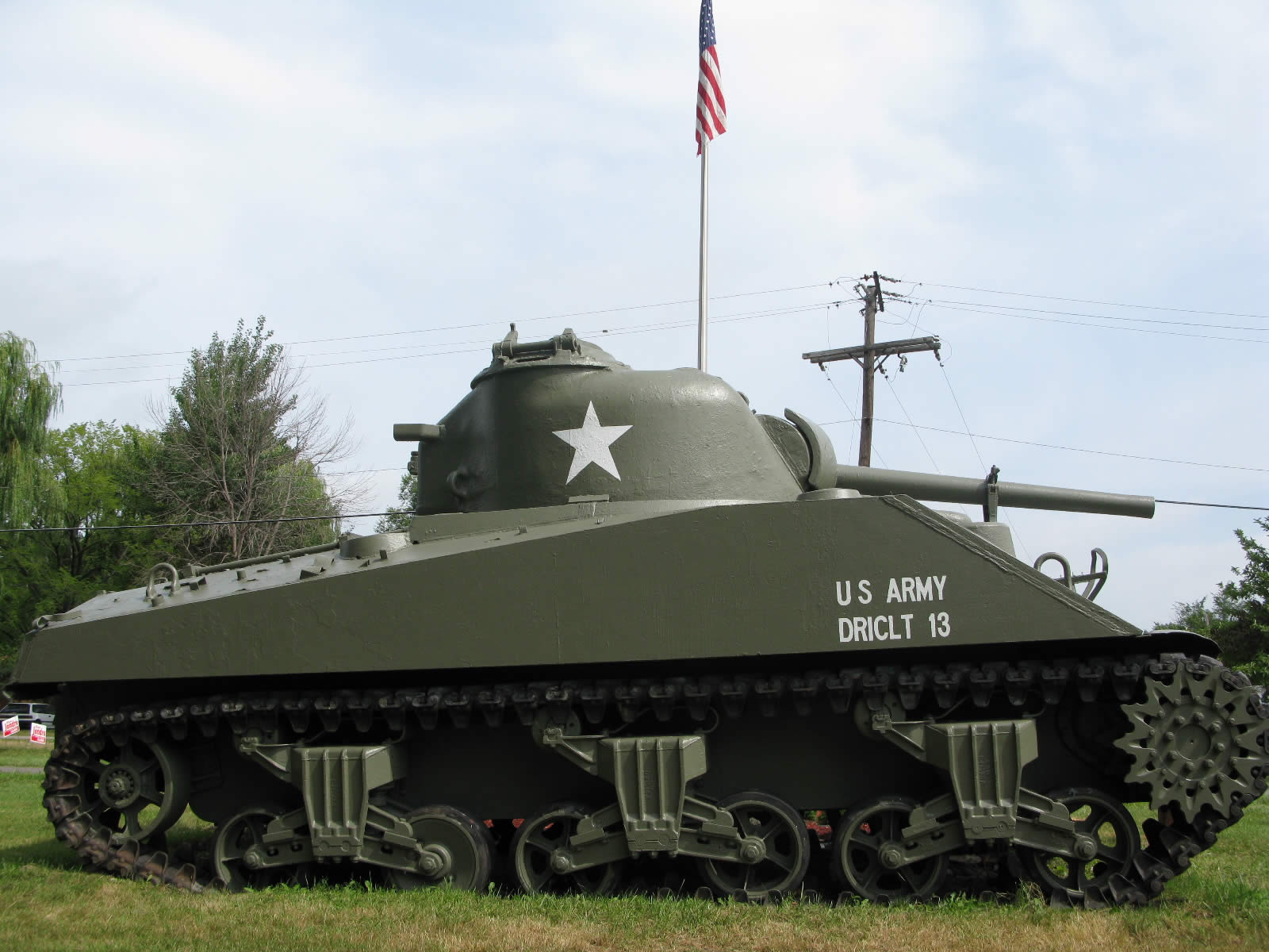 tank in front of flag